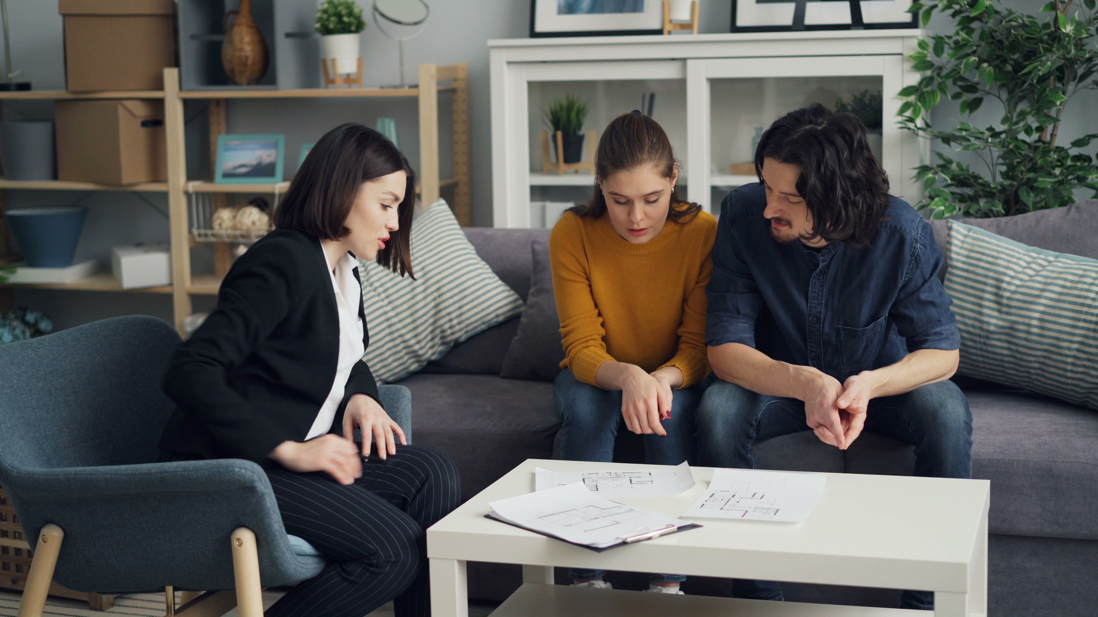 couple reviewing estate planning documents with an attorney